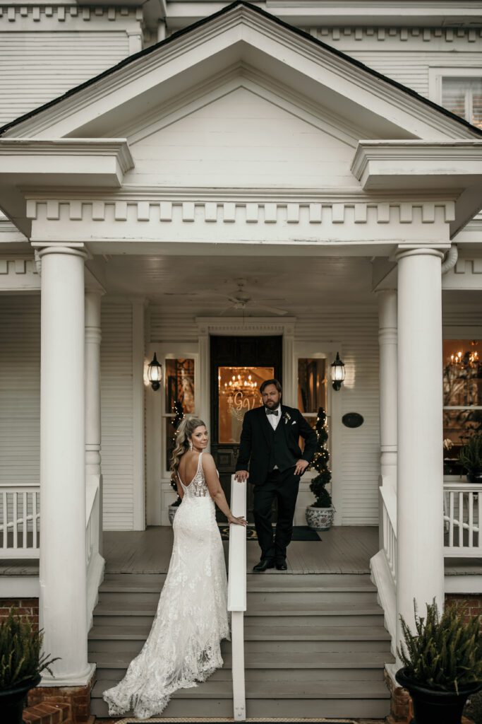 Bride and Groom posed editorial style in front of mansion wedding venue in Charlotte, North Carolina. 