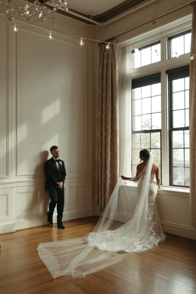 editorial-inspired-wedding-pose-of-bride-and-groom-by-window