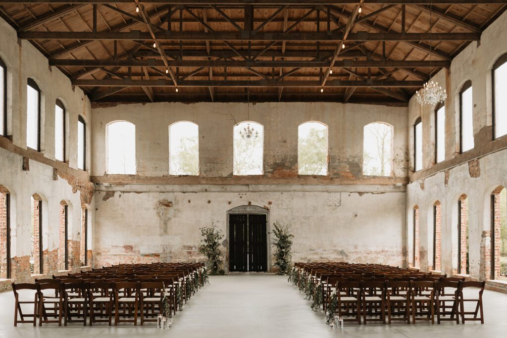 historic-open-air-north-carolina-wedding-venue-with-exposed-brick-and-arched-windows