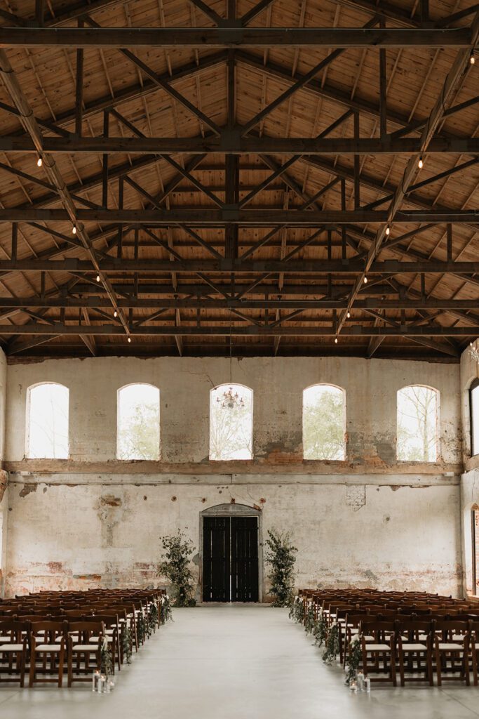 minimalist-inspired-indoor-wedding-ceremony-featuring-modern-organic-arch