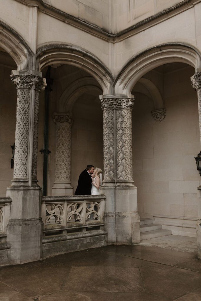 bride and groom portraits in the arches of the Biltmore estate