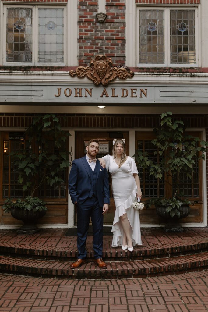 editorial bride and groom portrait on the steps of hotel sorrento in downtown seattle